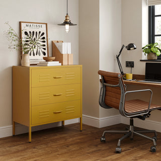 The Lambeth metal drawers in mustard yellow, in a room next to a desk