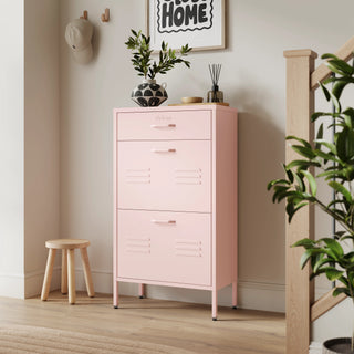 The Shoreditch shoe cabinet in pink with a top drawer, two lower shoe compartments and matching handles, styled in a hallway.